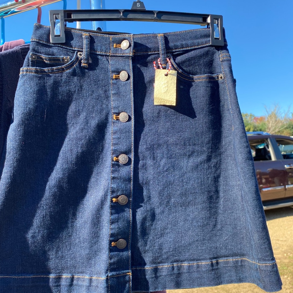 Dark wash denim button up skirt.